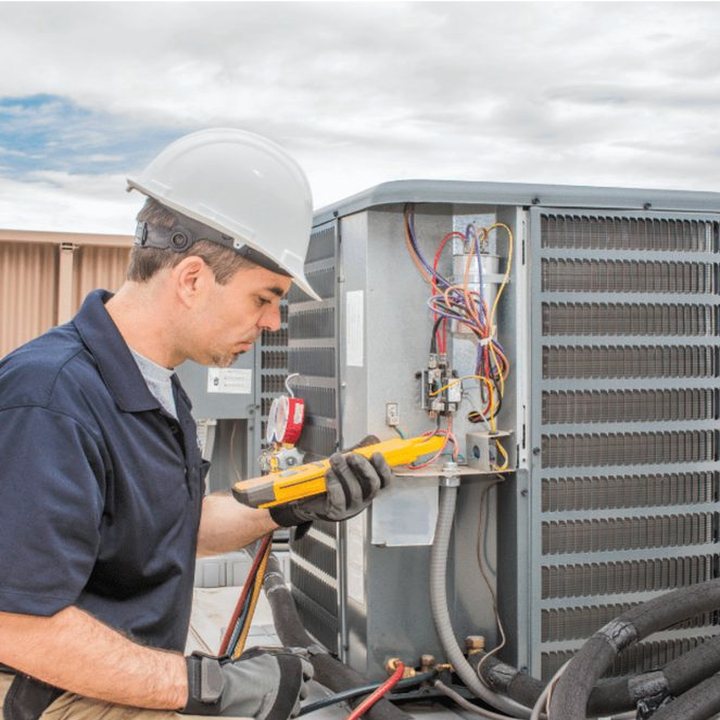 Milverton Heating & Cooling HVAC technician on a service call in Milverton, Ontario